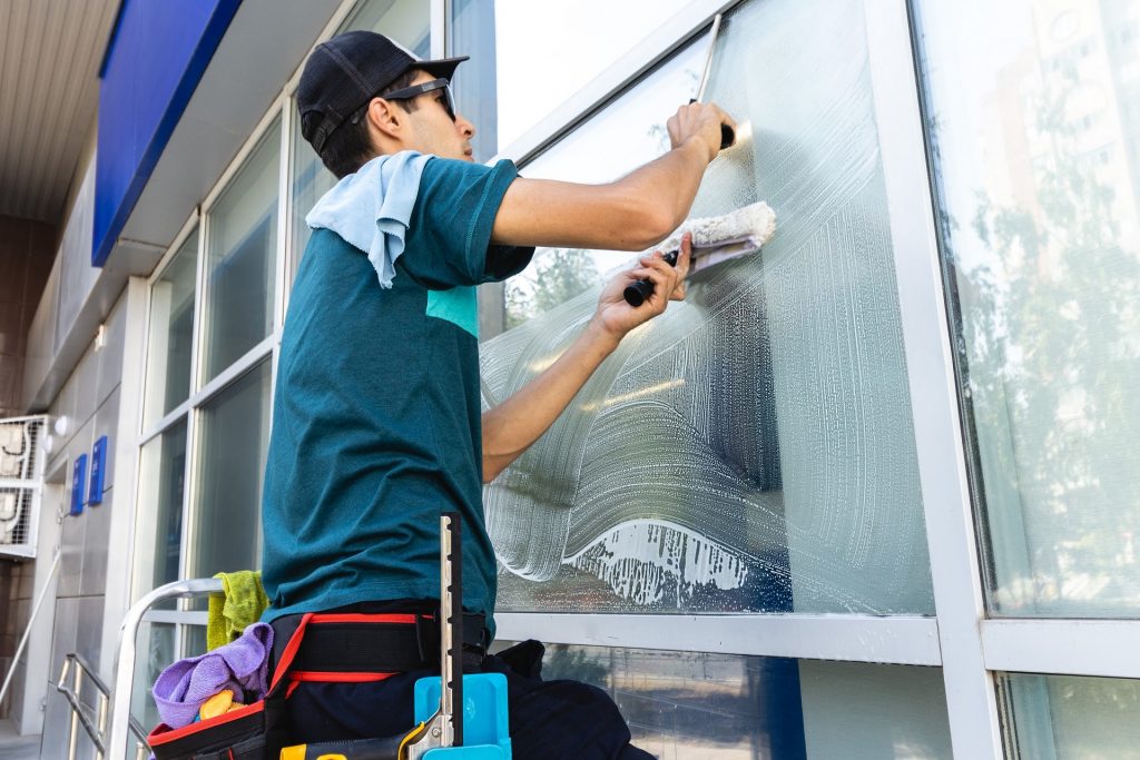 Male,Professional,Cleaning,Service,Worker,In,Overalls,Cleans,The,Windows